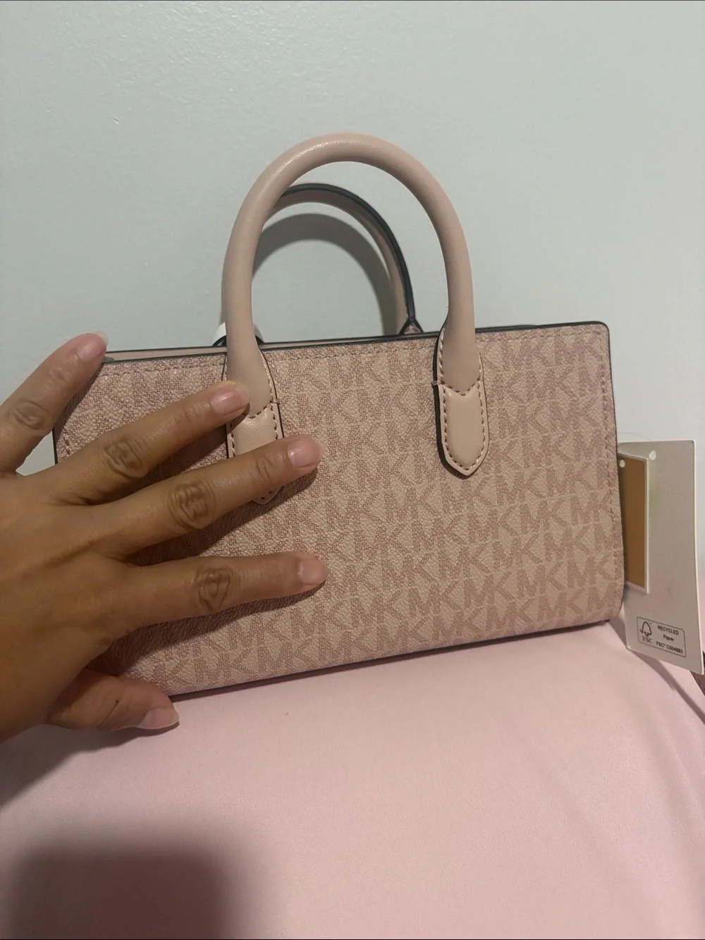 A cute MICHAEL KORS Blush Pink Logo Satchel with Floral Charm